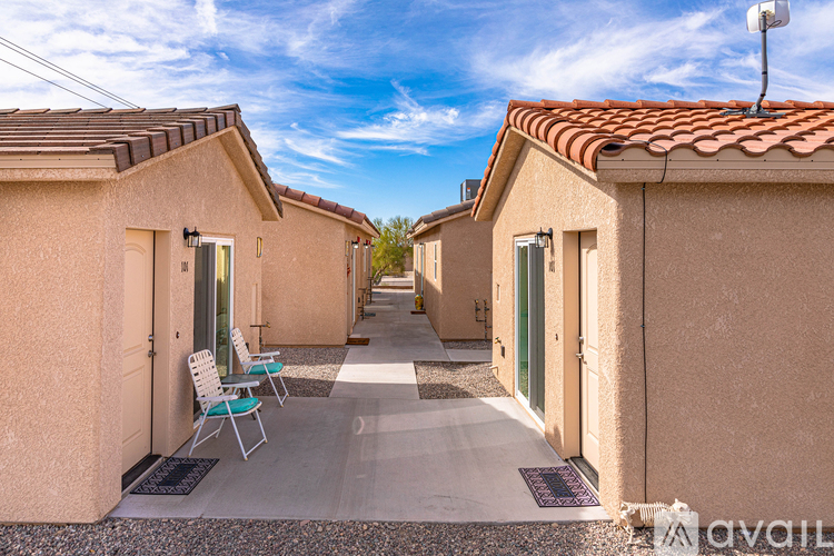 A row of houses with a clear blue sky above them.