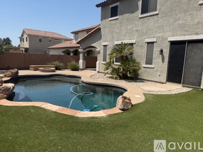 A house with a pool in the backyard.