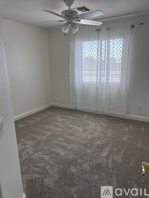 A room with a staircase and cabinets.