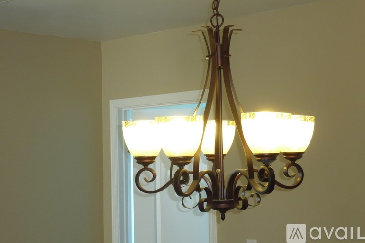 A chandelier with six lights hangs from the ceiling.