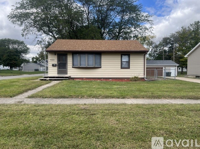 A small house with a brown roof and a red line on the ground in front of it.
