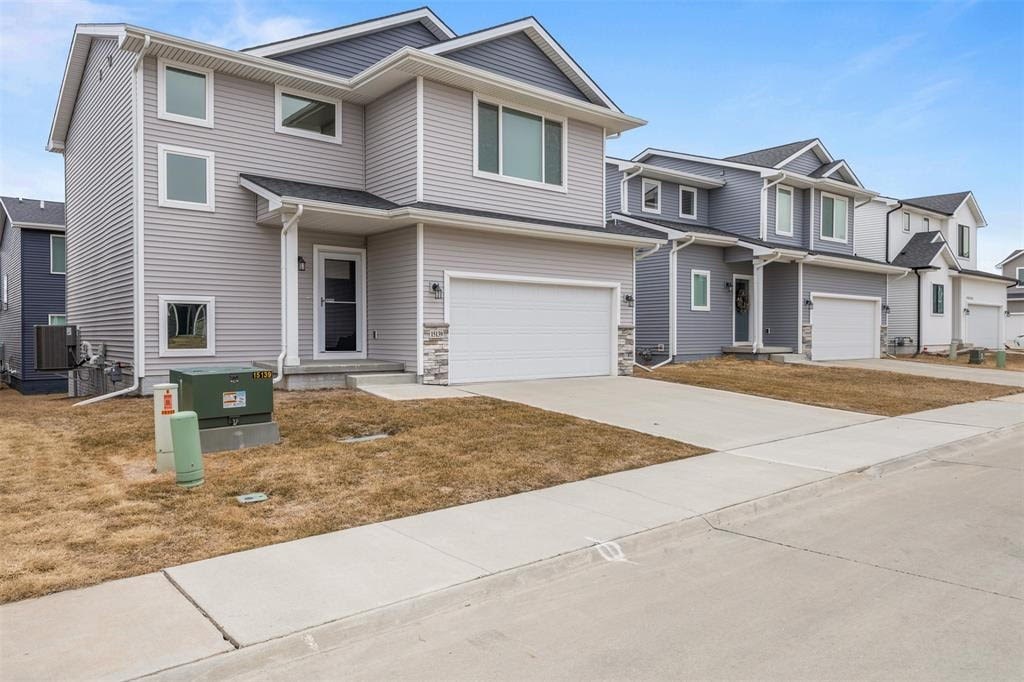 A row of houses with a clear blue sky above them.