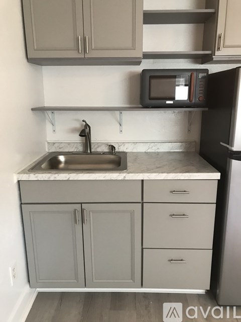 A kitchen with a sink and cabinets.