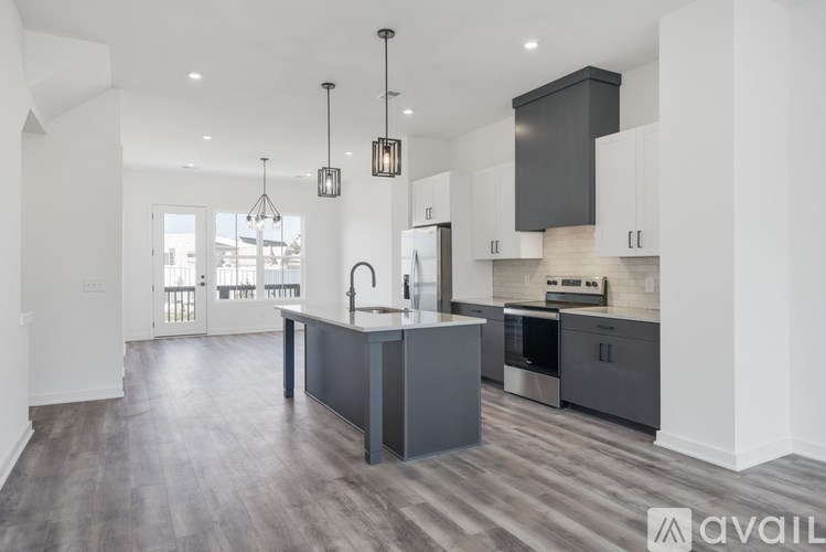 A modern kitchen with a large island in the middle.