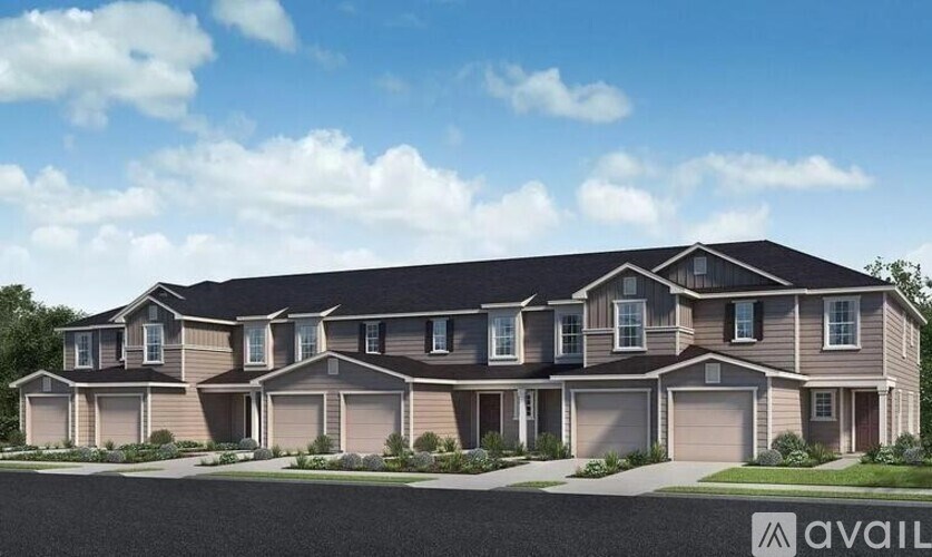 A large, modern house with a dark roof and multiple garages is available for purchase.