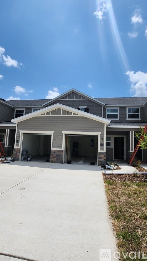 A house with a garage is for sale.