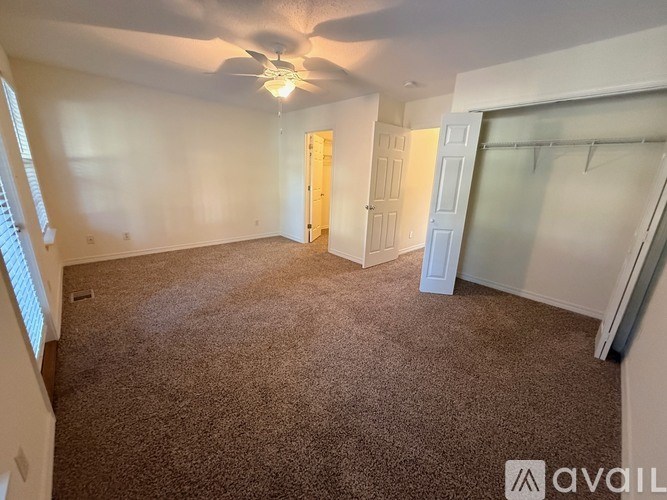 A bathroom with a toilet, sink, and bathtub.