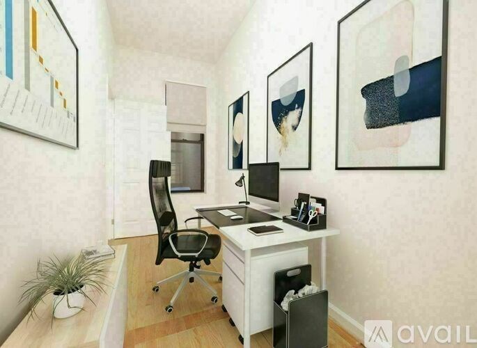 A white desk with a black chair and a computer monitor in a room with a white wall and a painting hanging on the wall.
