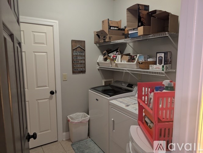 Laundry room with a washer and dryer.