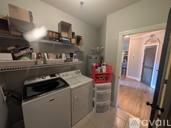 A laundry room with a washer and dryer.