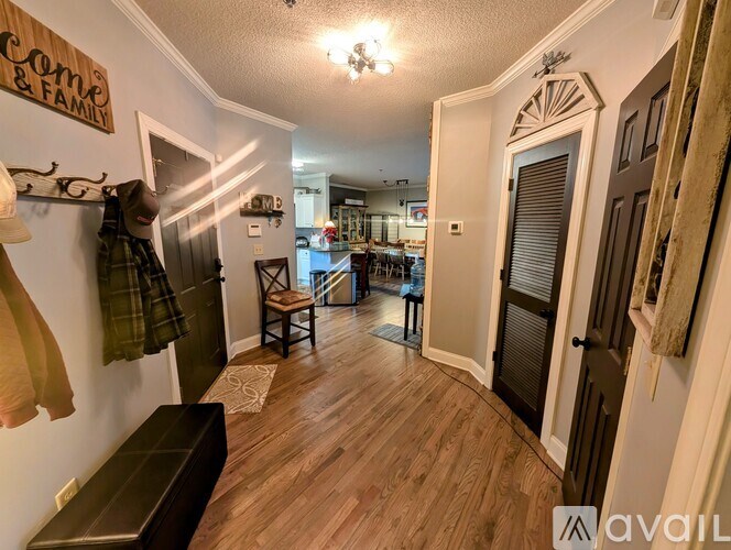 A hallway with a sign that says "Welcome Home & Family" on the wall.