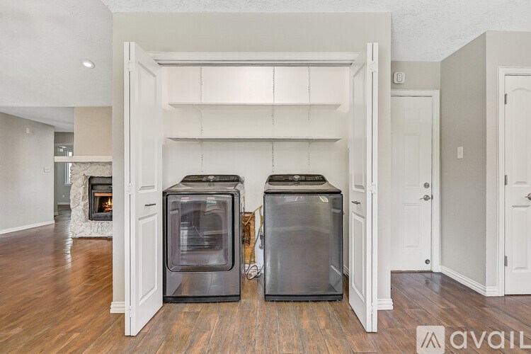 A kitchen with two ovens and a fireplace.