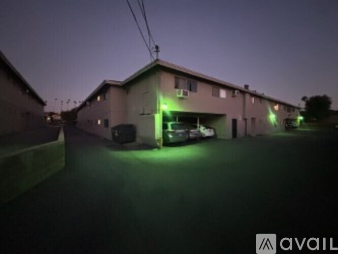 A building with green lights on it at night.