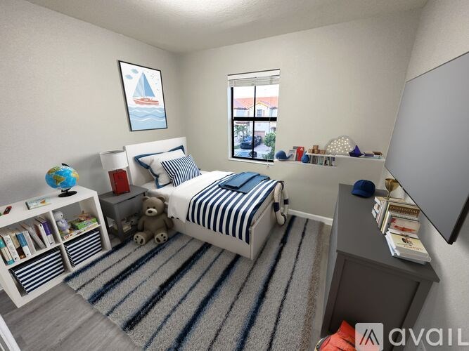 A bedroom with a bed, a bookshelf, a window, and a rug.