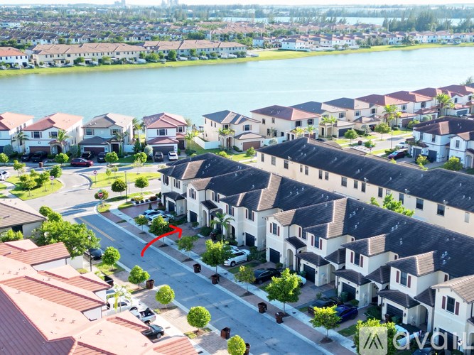 A residential area with houses and a road.