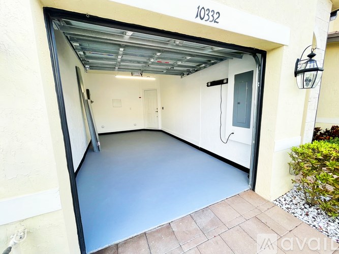 A garage with the number 10332 on the wall.