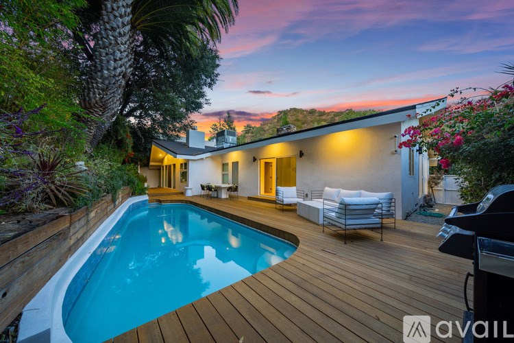 A house with a pool in the backyard.