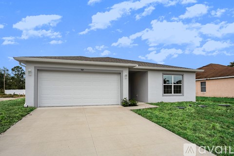 A two-car garage with a white door and a brown roof.