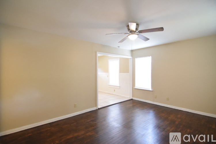 A small house with a brown front porch.