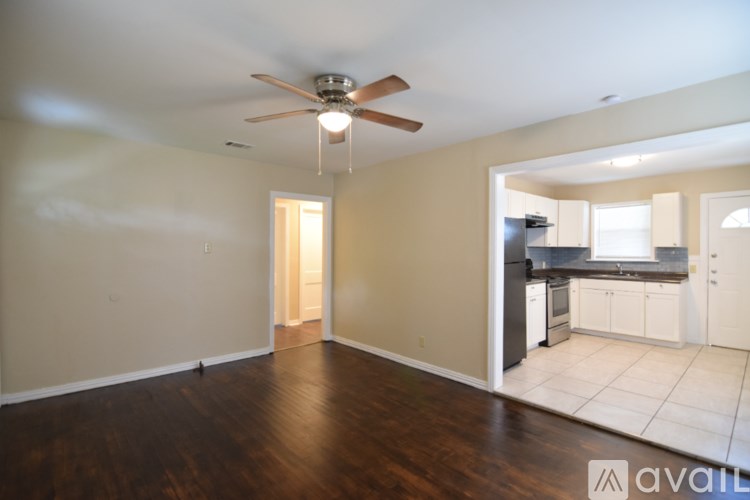 A backyard with a shed and a house.