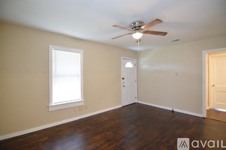 A backyard with a shed and a fence.