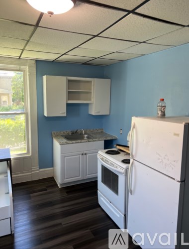 A kitchen with a white refrigerator and a white oven.