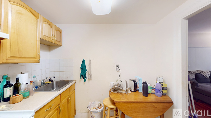 A kitchen with wooden cabinets and a white countertop.