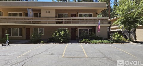A building with a balcony and a flag on it.
