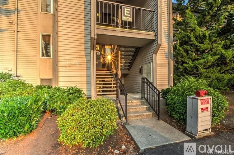 A building entrance with a red fire hydrant in front.