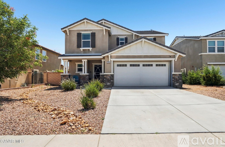 A modern house with a garage is for sale.