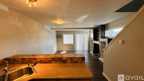 A kitchen with a sink and a window.
