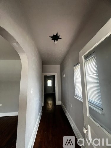 A long hallway with a star on the ceiling.