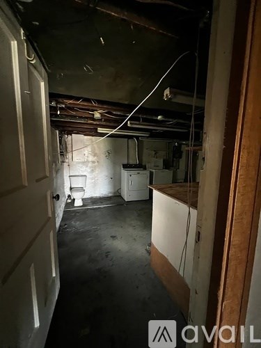 A room with a toilet and a sink in it.