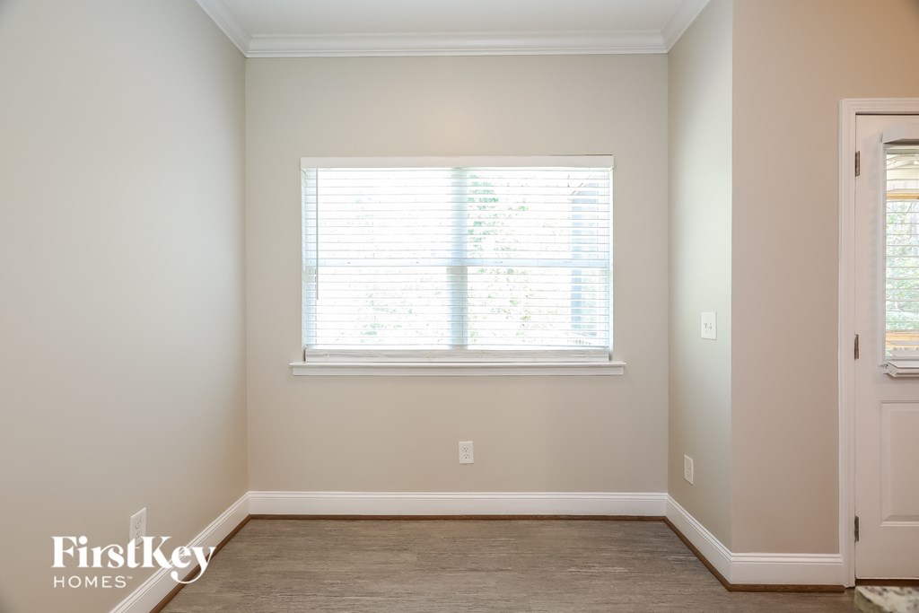 A room with a window and a door.