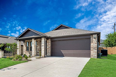 A house with a garage and a driveway.