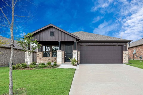 A house with a garage and a driveway.