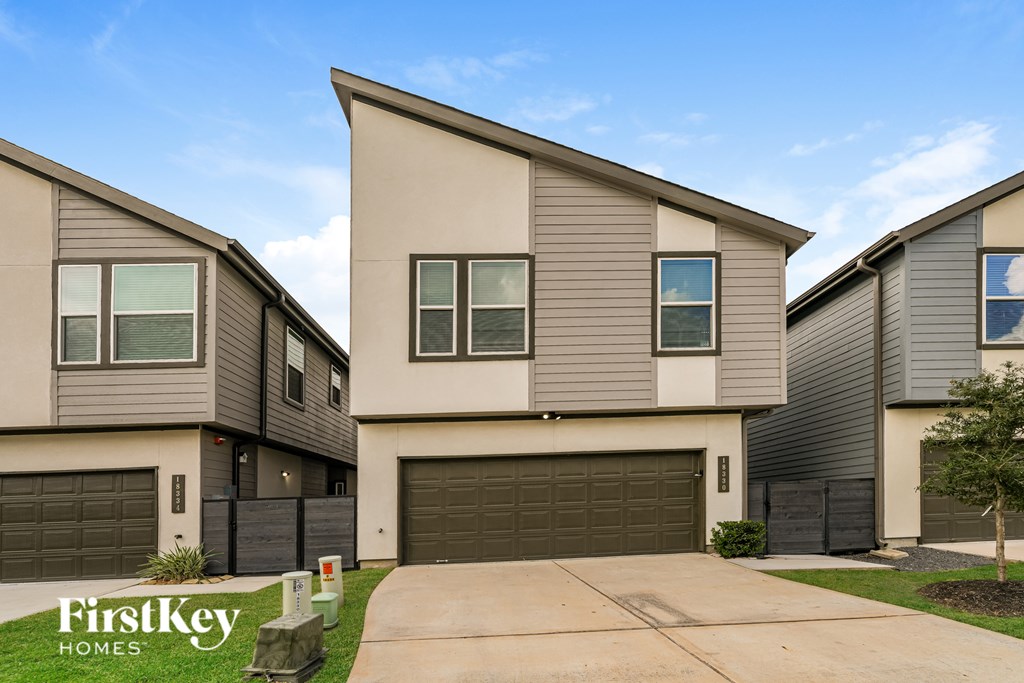 A row of houses with the text "FirstKey Homes" in the foreground.