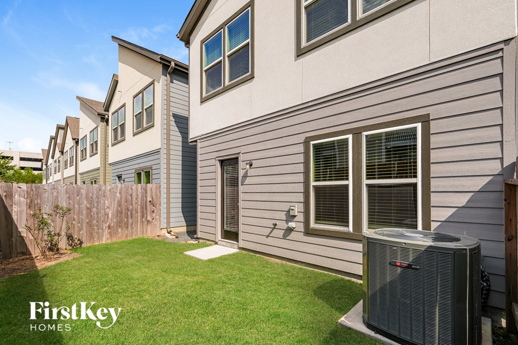 A row of houses with a FirstKey Homes logo.