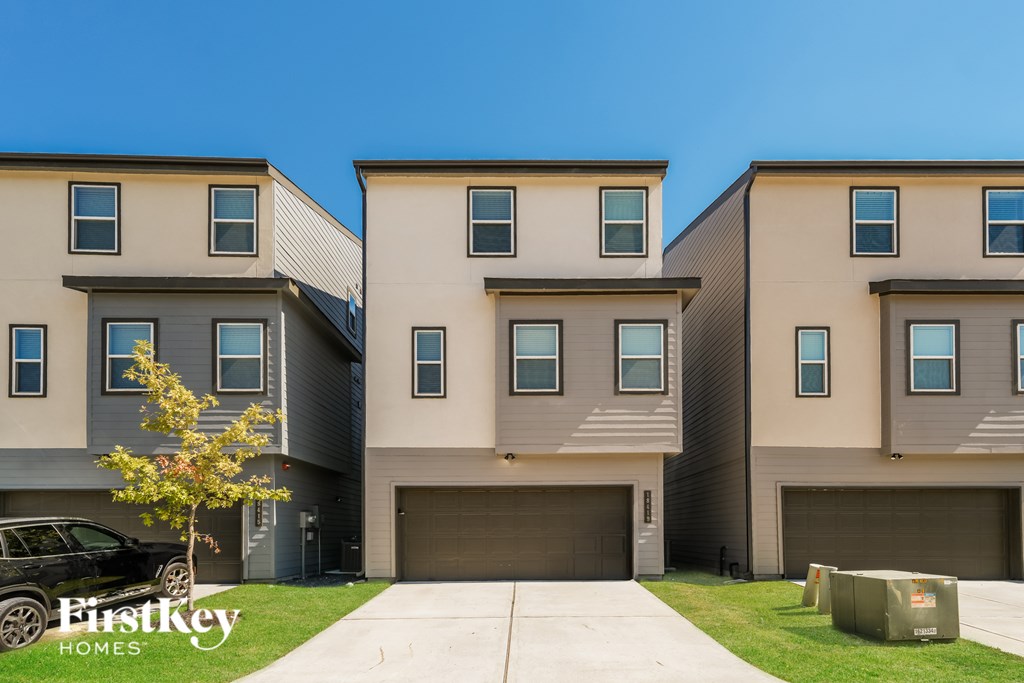 A row of houses with the text "Firstkey Homes" on the bottom left.