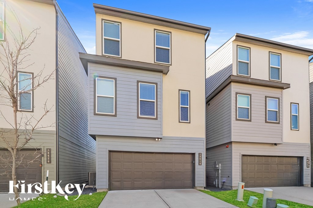 A row of houses with the words "Firstkey Homes" written on the bottom left.