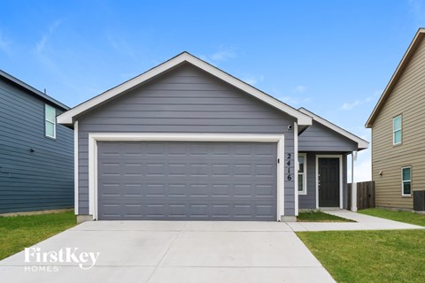 A house with a garage door that says 2416.