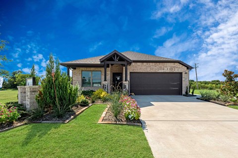 A house with a garage and a driveway.
