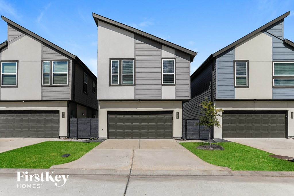 A row of houses with the words "FirstKey Homes" on the bottom left.