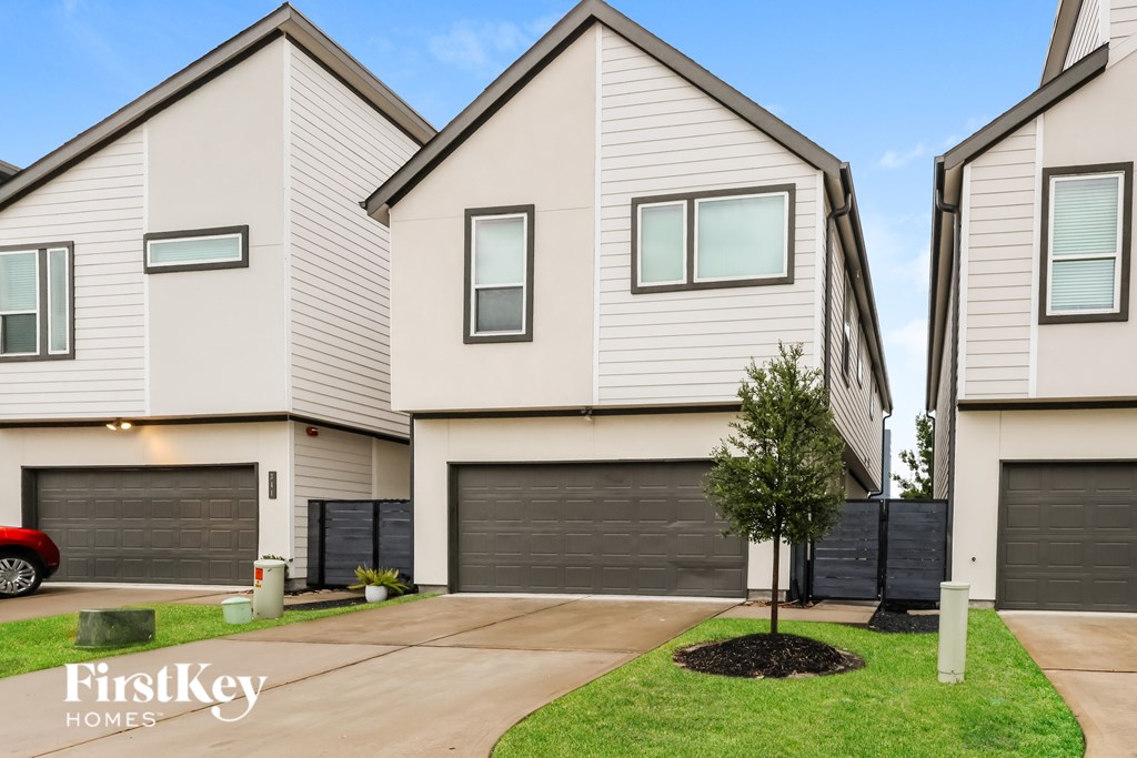 A row of houses with the logo "FirstKey Homes" on the bottom left.