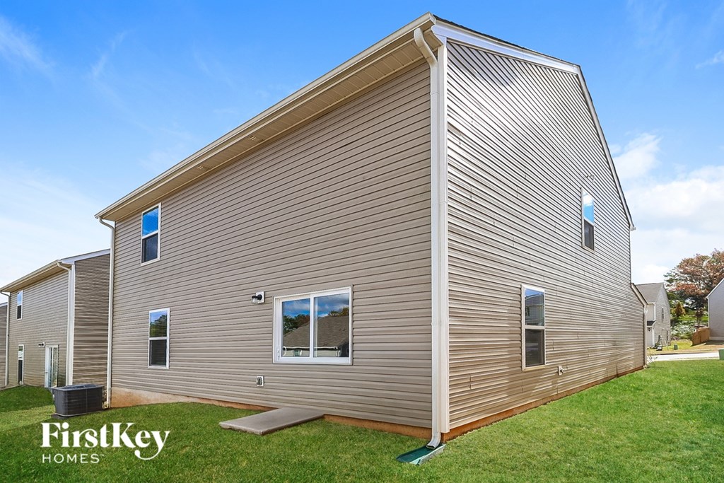 A house with a brown siding and a blue window.