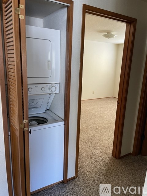 A small kitchen with a white dishwasher and oven.