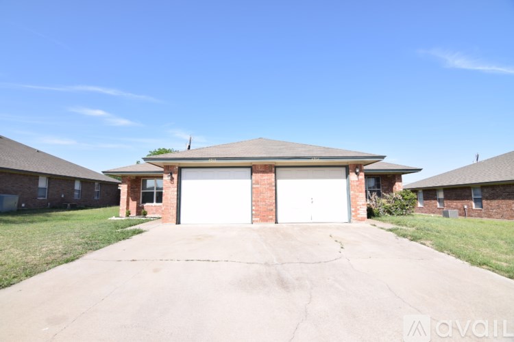 A house with a garage is available for sale.