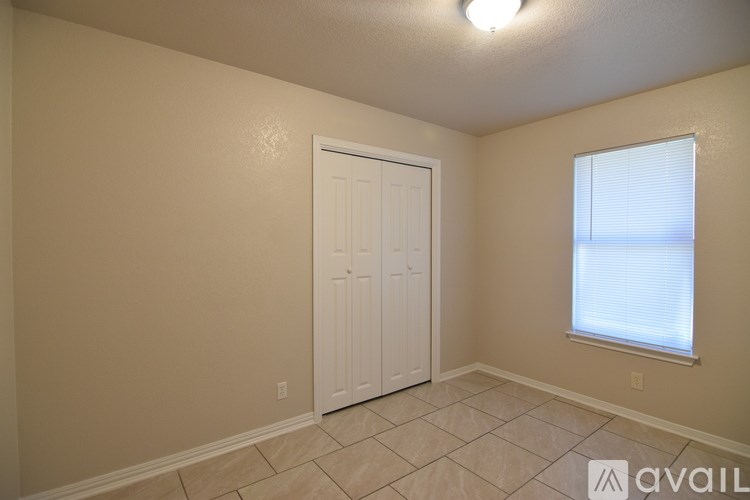 A bathroom with a sink, toilet, and bathtub.