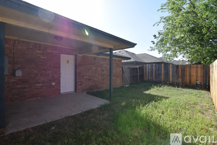 A house with a white door and a covered patio.