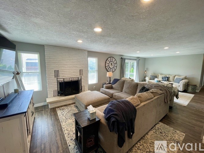 A living room with a fireplace and a couch.